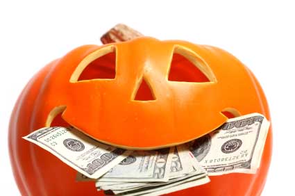 Pumpkin with money in mouth