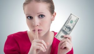 A young woman keeping money secrets