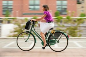 A business woman riding a bike to work