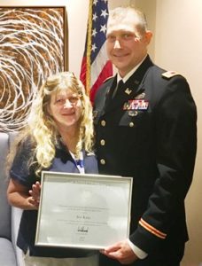 Sue Katz received President’s Lifetime Achievement Award from Lieutenant Colonel Nick Wilder