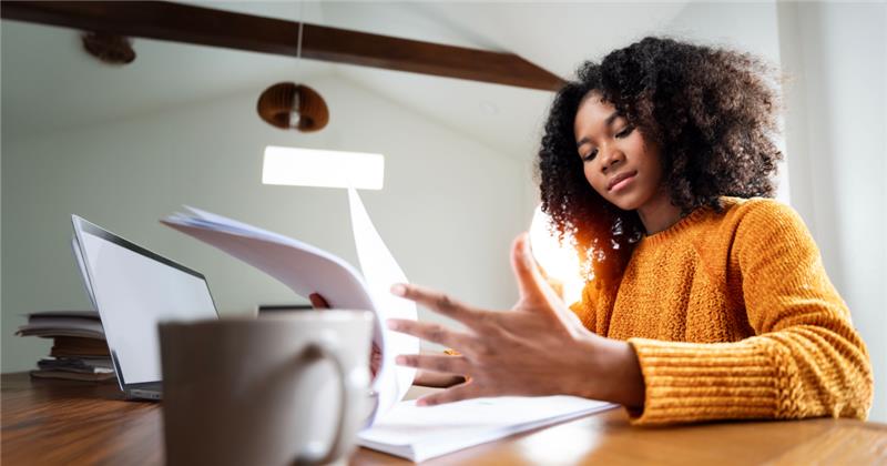 a girl reading documents